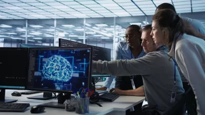 man requesting help from coworkers after finding bug data center systems 400x225